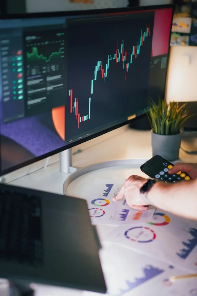 financial analyst monitoring blockchain-driven data charts on a computer screen, symbolizing decentralized research monetization and verifiable on-chain analytics